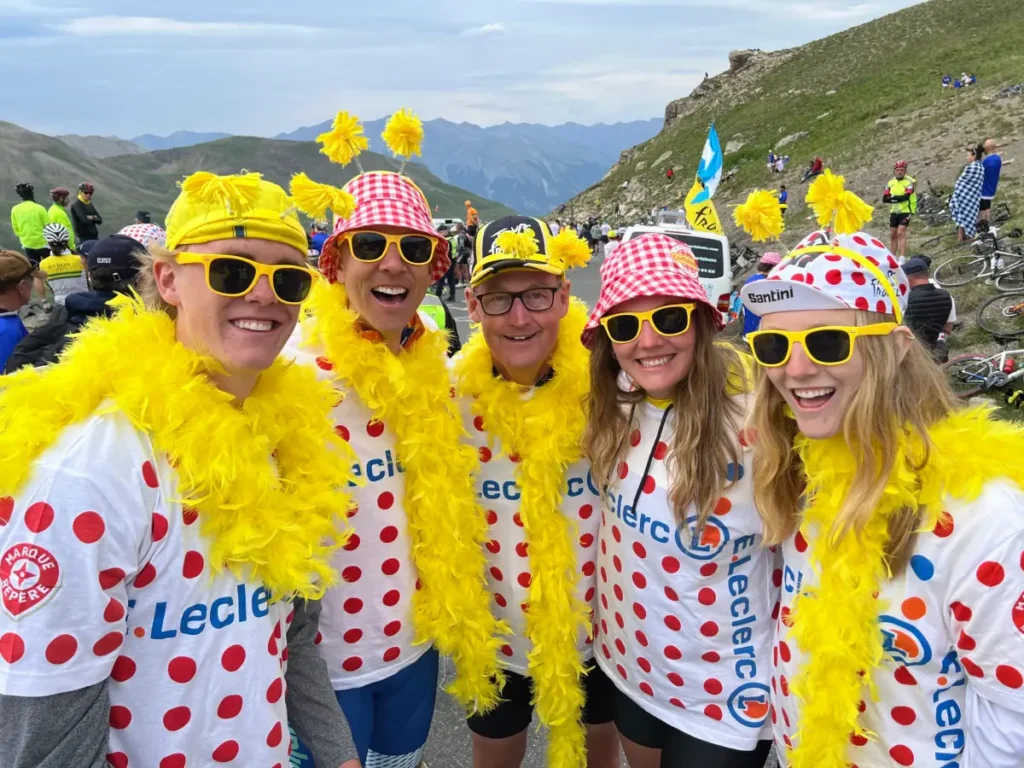 Family enjoying the Tour de France in the high French Alps with a guided tour.